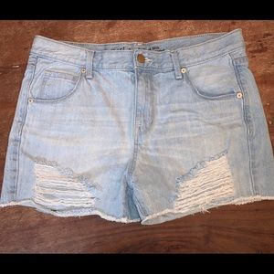 Light wash destressed midi shorts